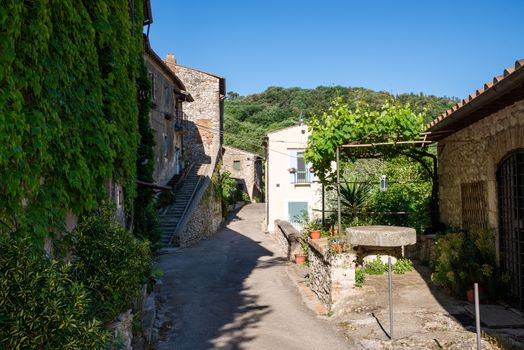 stifone, italy may 22 2020: road inside the country of stifone all made in stone