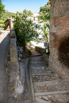 stifone, italy may 22 2020: road inside the country of stifone all made in stone