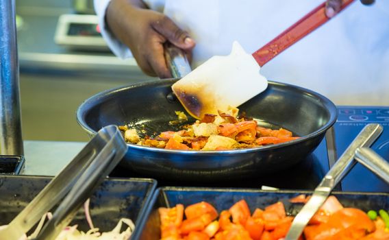 Chef Sauteeing Food in Pan