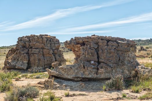 A rock formation, called Masada, on the Eland Hiking Trail at Eingedi near Ladybrand. A white eland spoor trail marker is visible