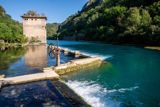 bulk of the country of a blue-watered siphon where boys bathe in the summer