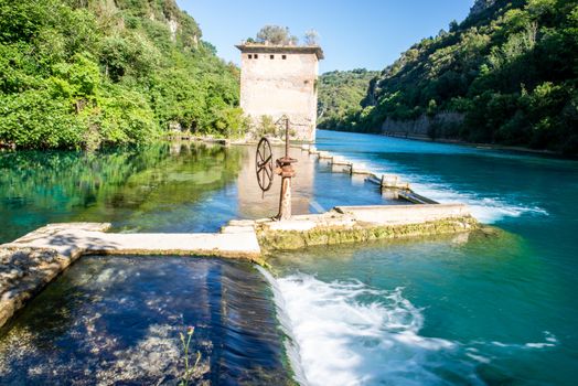 bulk of the country of a blue-watered siphon where boys bathe in the summer