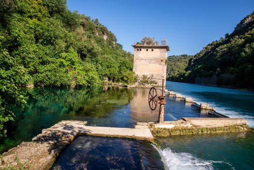 bulk of the country of a blue-watered siphon where boys bathe in the summer