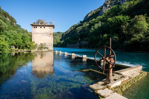 bulk of the country of a blue-watered siphon where boys bathe in the summer