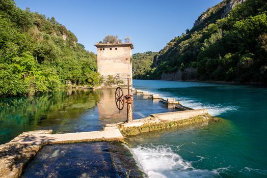 bulk of the country of a blue-watered siphon where boys bathe in the summer