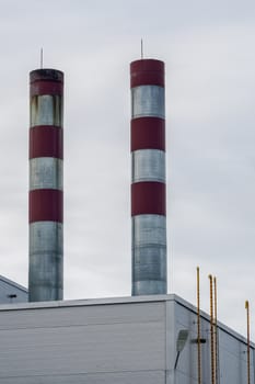 gas boiler tubes and part of the roof of an industrial building with elements of fire infrastructure