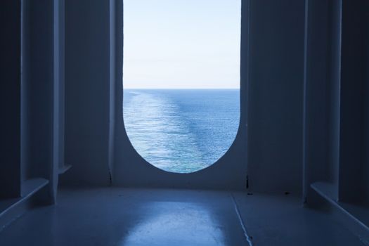 The view from a ship's stern as it travels across the ocean.