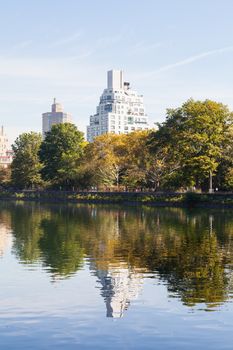 The view across the Jackie Onassis Reservoir in Central Park, New York City on a still autumn morning.