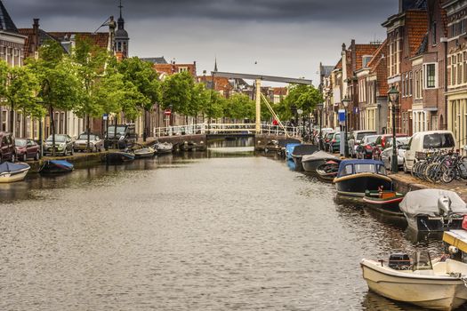 Panoramic view of a canal with facades of old buildings and drawbridges in the center of Alkmaar. netherlands holland