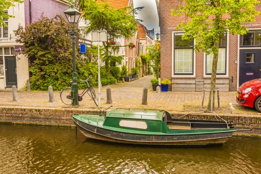 Typical boat in a channel of an Alkmaar neighborhood. netherlands holland