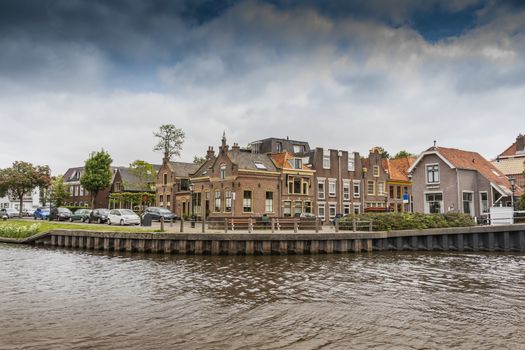 landscape of a typical neighborhood on a canal in the city of Alkmaarr. netherlands holland