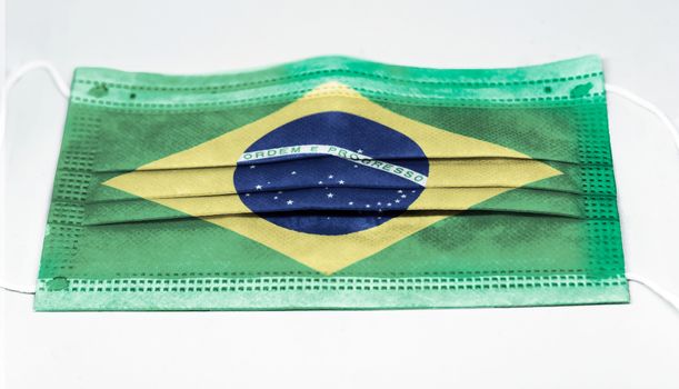 surgical mask with the national flag of Brazil printed. Pandemic covid-19 and preventive measures to counter the spread of the virus