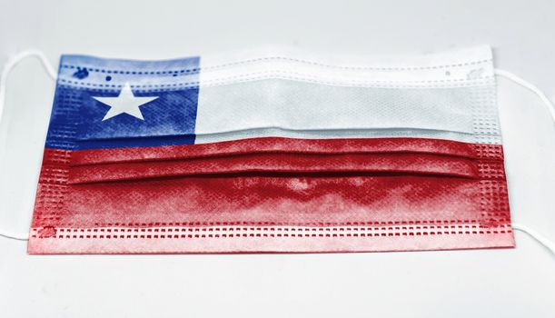surgical mask with the national flag of Chile printed. Pandemic covid-19 and preventive measures to counter the spread of the virus