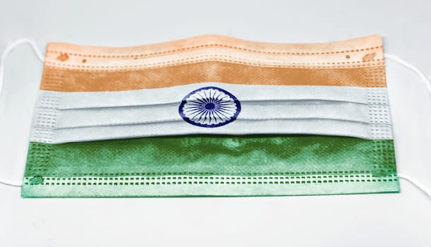 surgical mask with the national flag of India printed. Pandemic covid-19 and preventive measures to counter the spread of the virus
