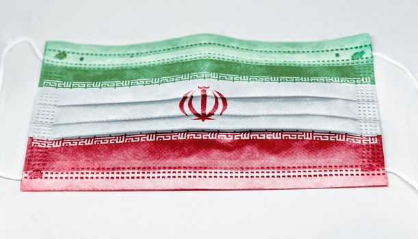 surgical mask with the national flag of Iran printed. Pandemic covid-19 and preventive measures to counter the spread of the virus