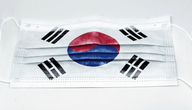 surgical mask with the national flag of South Korea printed. Pandemic covid-19 and preventive measures to counter the spread of the virus