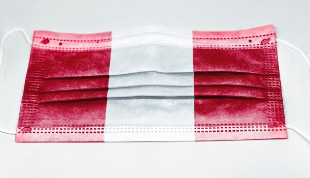 surgical mask with the national flag of Peru printed. Pandemic covid-19 and preventive measures to counter the spread of the virus