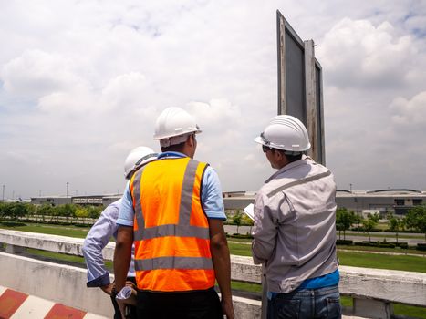 male engineers construction foreman managers outdoors at building site