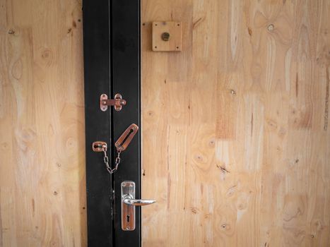 New brown modern wooden door lock in house interior