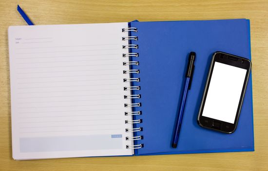 mobile phone blue diary book on table office