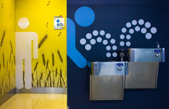Washing hands in a public restroom and Public Drinking water