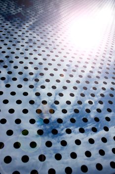 Glass sun blue black dot on Building