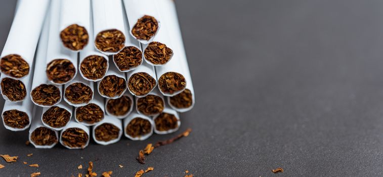 31 May of World No Tobacco Day, Close up front stack pile cigarette or tobacco on black background with copy space, Warning lung health concept