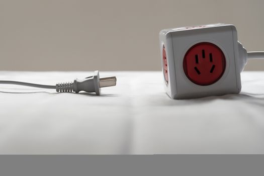 socket and plug electric power cube white color, save energy and reduce energy efficiency concept