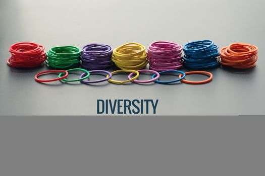 Diversity concept. mix colorful rubber band on black background with text Diversity, Ethnicity, Equality, Age, Sexual Orientation