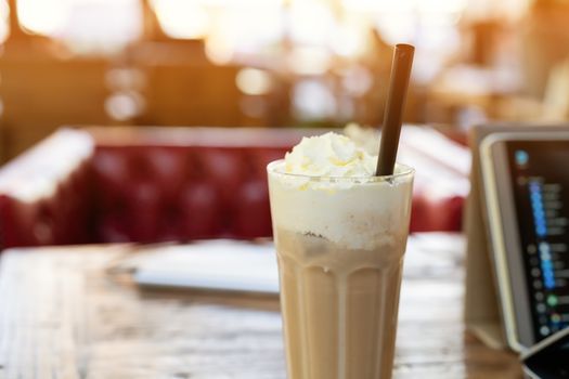 ice mocha coffee on wooden table smart computer pad
