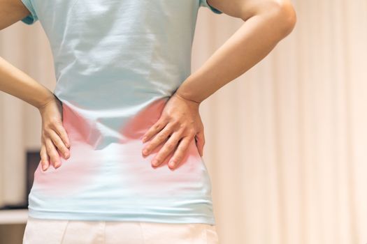 back pain at home. women suffer from backache. healthcare and medical concept