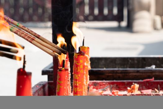 SHANGHAI,CHINA - JUN 2018: Longhua temple in Shanghai, China. lighting the candle to pray to Buddha