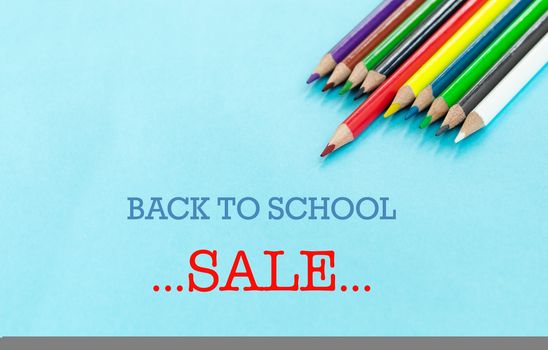 back to school Concept. Close up shot of color pencil pile pencil nibs on blue background