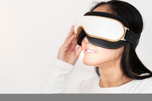 relax and massage, electric eye massage machine on women, closeup, healthcare and medicine concept