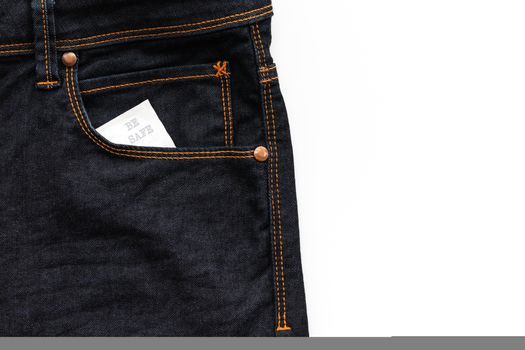 Condom in the jeans pocket with word be safe