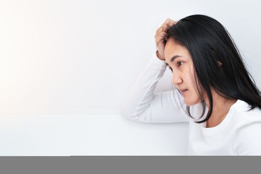 depressed women sitting in the corner of the room, alone, sadness, emotional concept