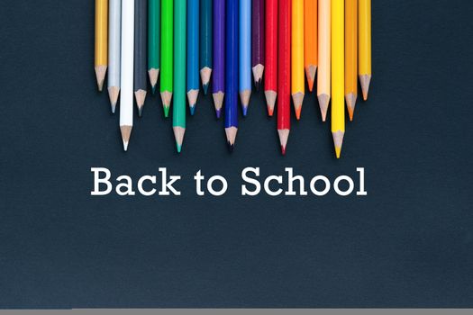 back to school Concept. Close up shot of color pencil pile pencil nibs on black background