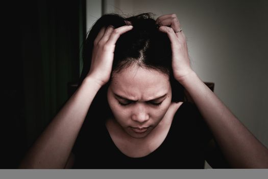 depressed women sitting near curtain in living room, alone, sadness, emotional concept