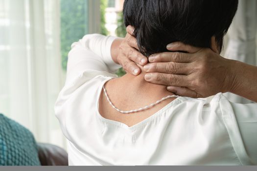 old woman suffering from neck pain, closeup, health problem concept