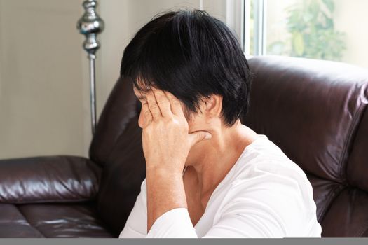 old woman suffering from headache, stress, migraine, health problem concept