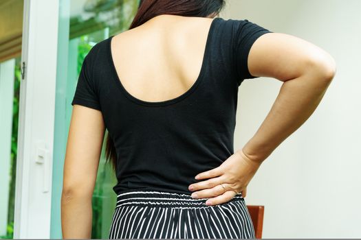 back pain at home. women suffer from backache. healthcare and medical concept