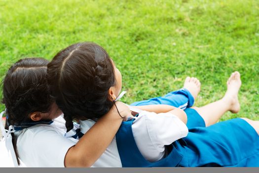 two little asian girls sisters hugging happy post in school uniform, back to school concept