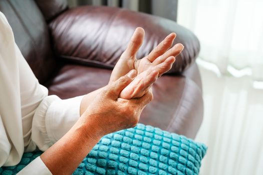 old woman suffering from wrist hand pain, health problem concept