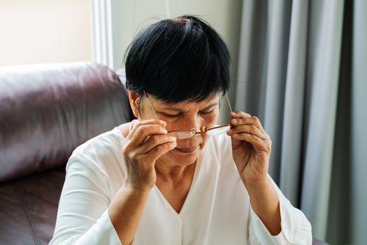 portrait of old woman wearing her glasses