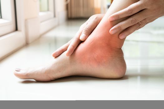 women leg ankle injury/painful, women touch the pain ankle leg