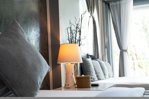 comfortable living room, grey pillow and desk lamp