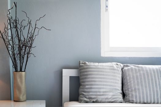 comfortable living room, grey pillow on sofa with window, copy space.