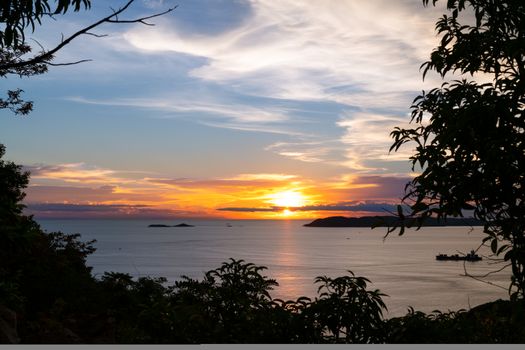 Beautiful blazing sunset landscape at black sea and orange blue sky