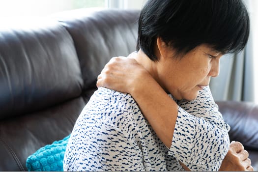 old woman suffering from neck pain, closeup, health problem concept