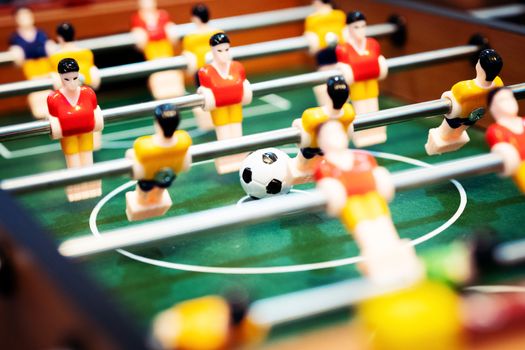 Foosball table soccer. football player, sport concept
